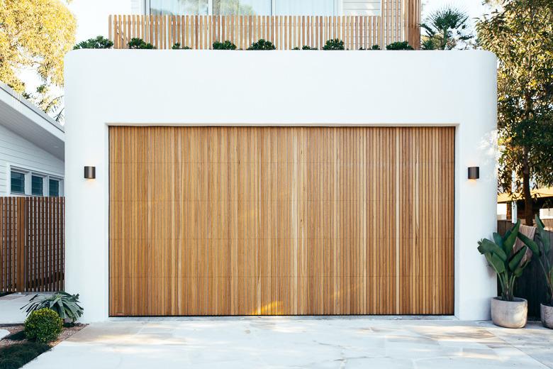 wood modern garage doors on white garage