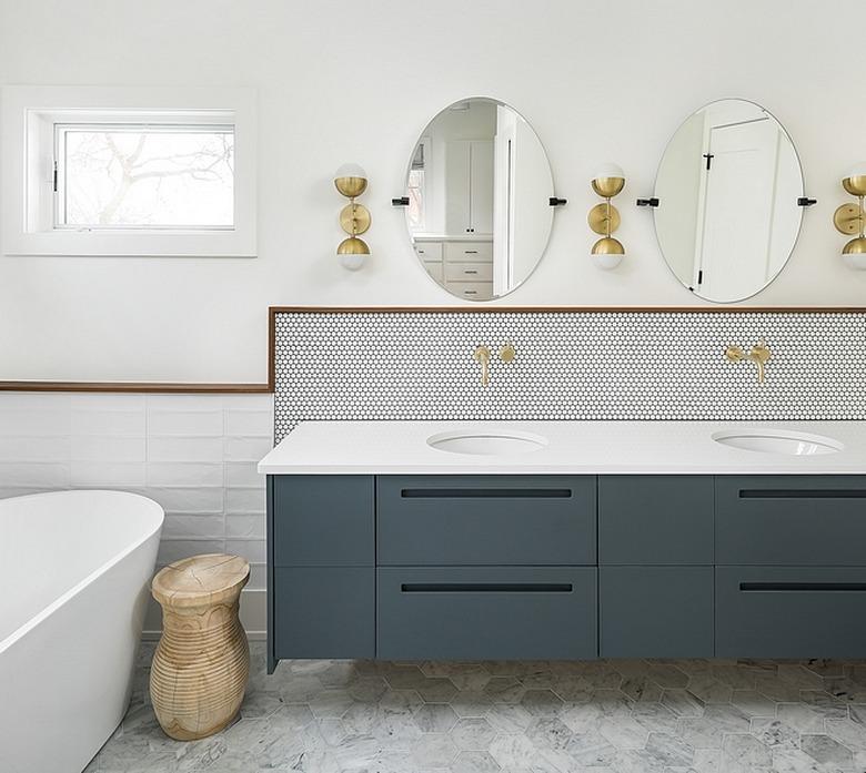 framed mosaic tile bathroom backsplash idea in modern space with midcentury lighting