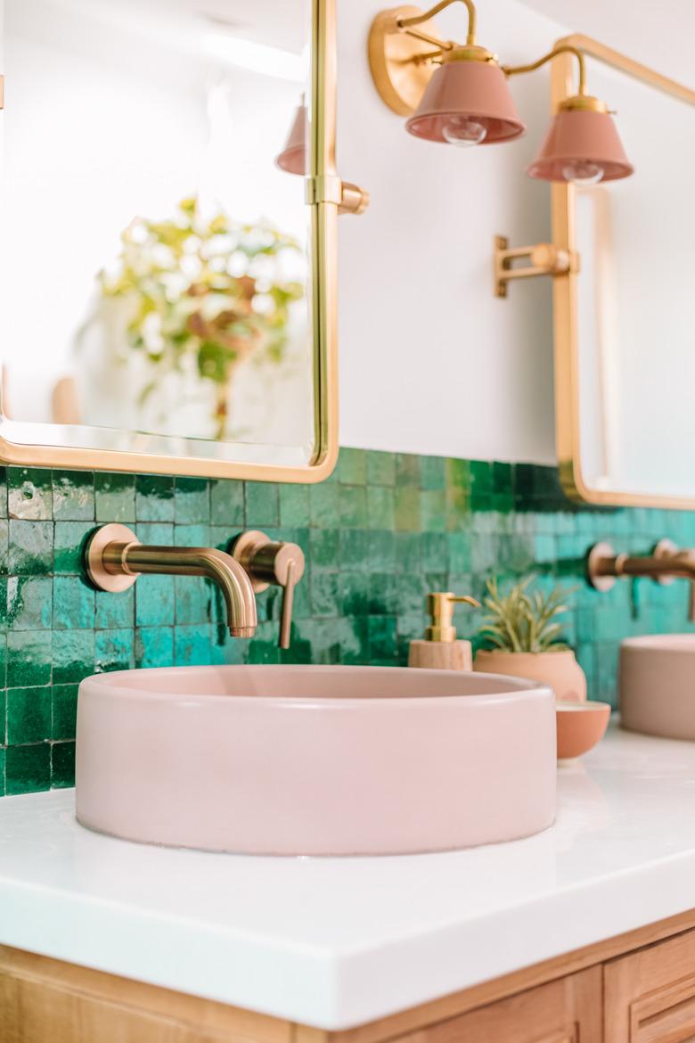 boho bathroom with pink basin and mosaic tile bathroom backsplash idea