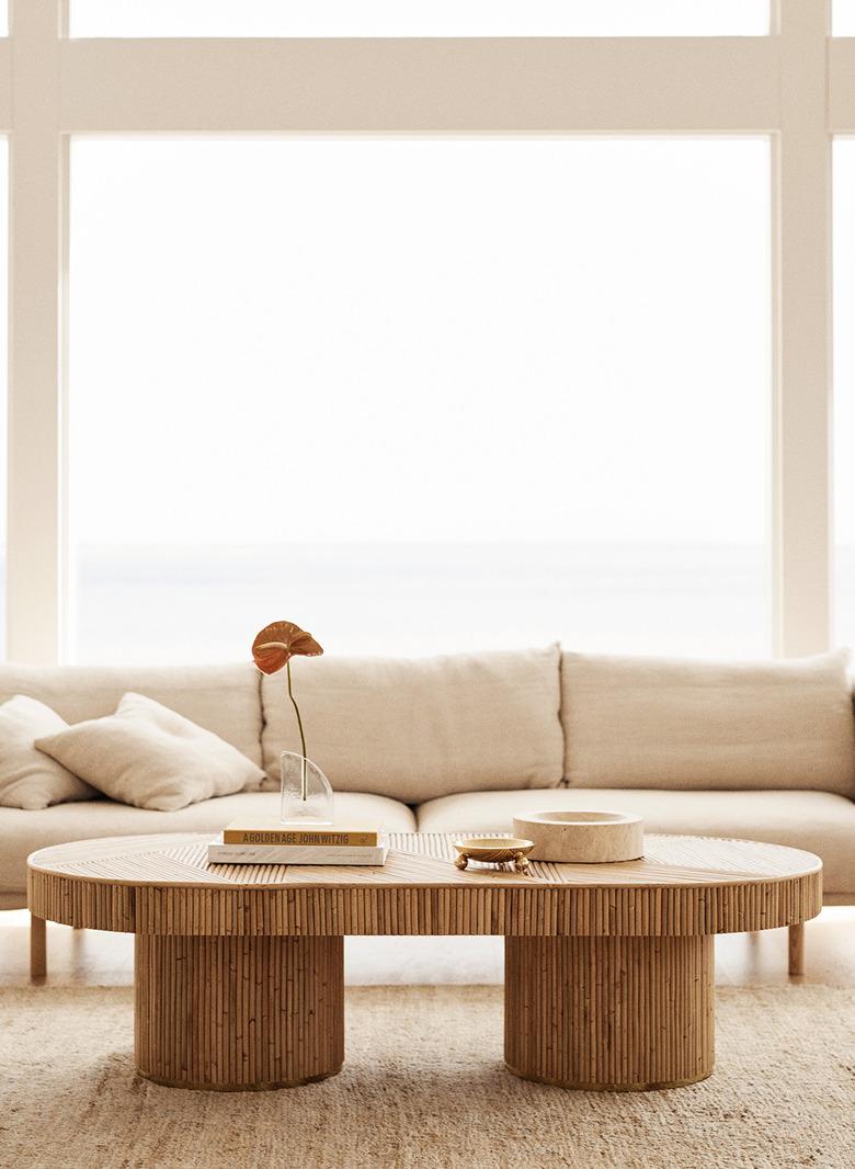 natural decor with cream sofa with rattan coffee table