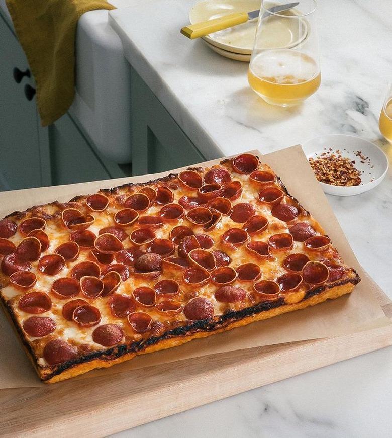 A Cozy Kitchen Detroit-Style Pizza on wood cutting board