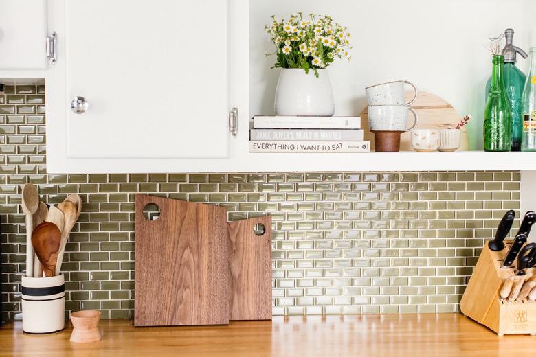 Kitchen counter with cutting boards and utensils