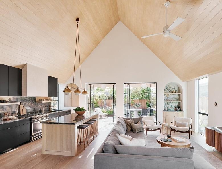 open concept living room with cathedral ceiling