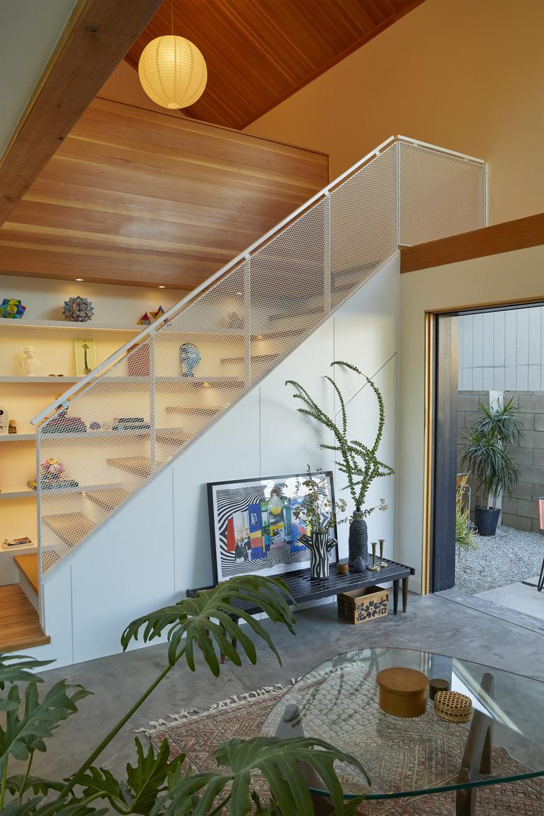 open concept living room with minimalist staircase