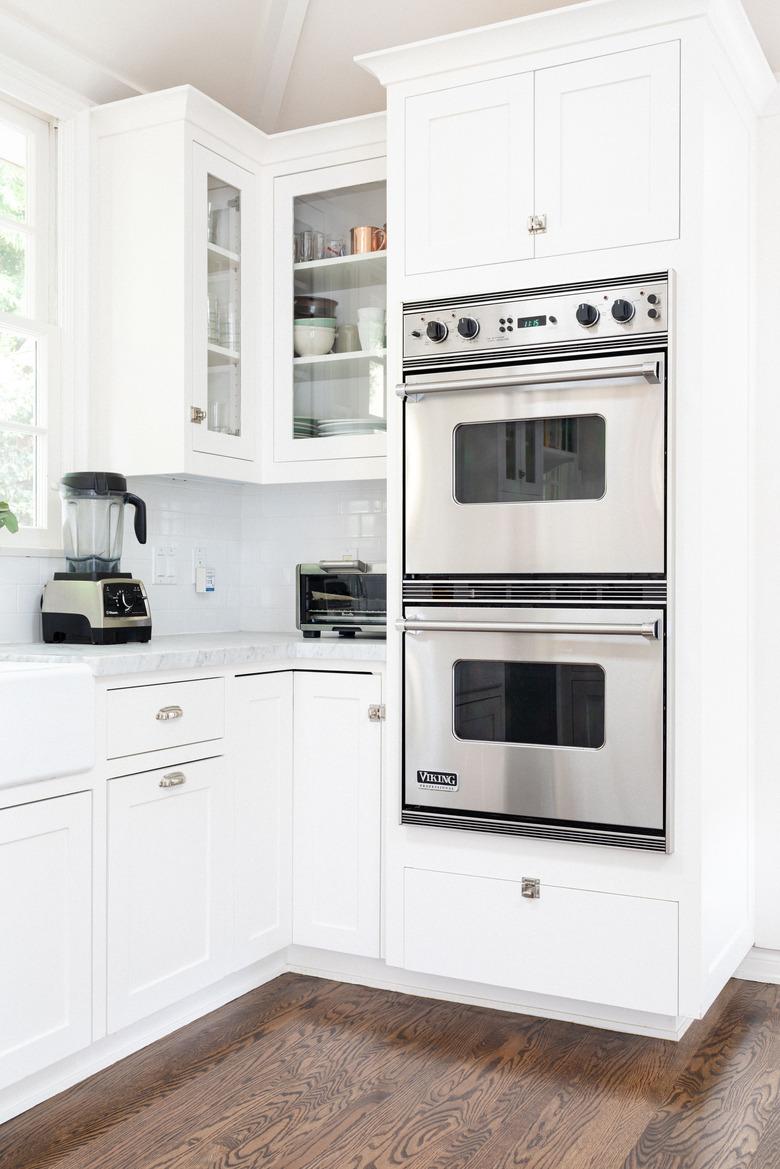 double wall oven installed in white cabinetry