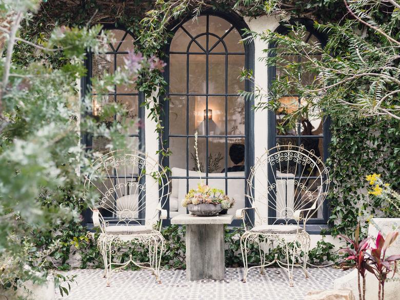 Outdoor seating patio area in front of window