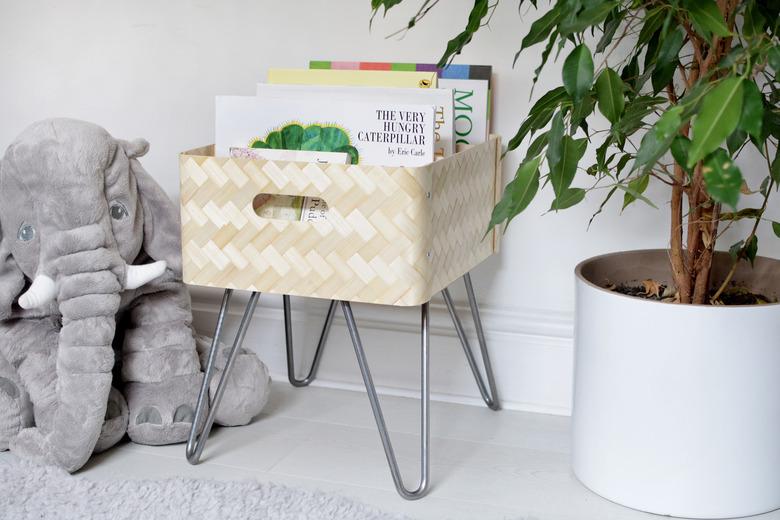 playroom storage idea with IKEA hack for book storage in bamboo bin