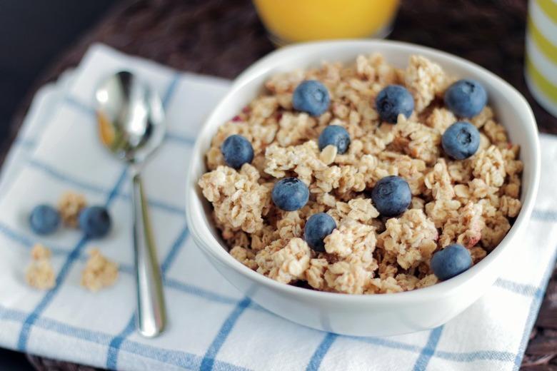 Cereal and blueberries in a white bowl