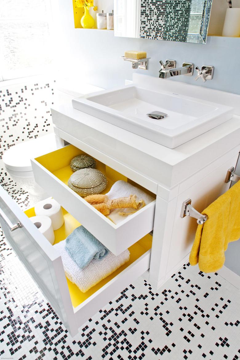 blue bathroom with black and white mosaic floor tile