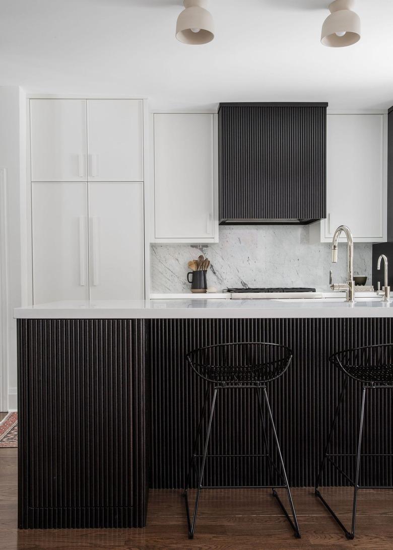 modern kitchen with reeded cabinets in espresso finish