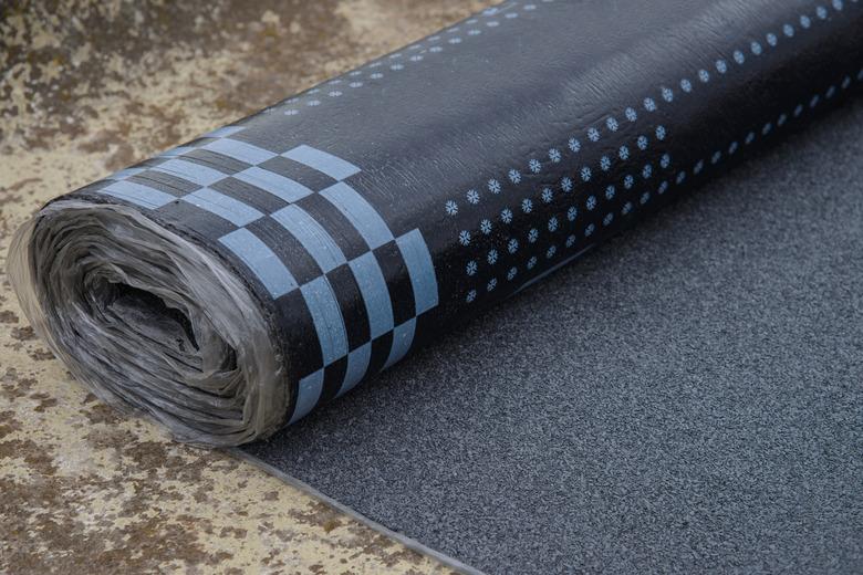 Waterproof bitumen roll covered with insulation materials.