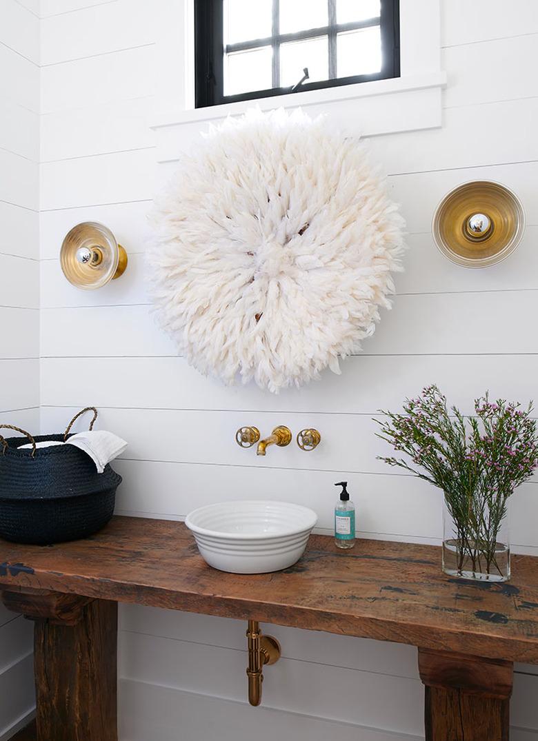 white shiplap bathroom with gold fittings, fixtures, and rustic glam decor