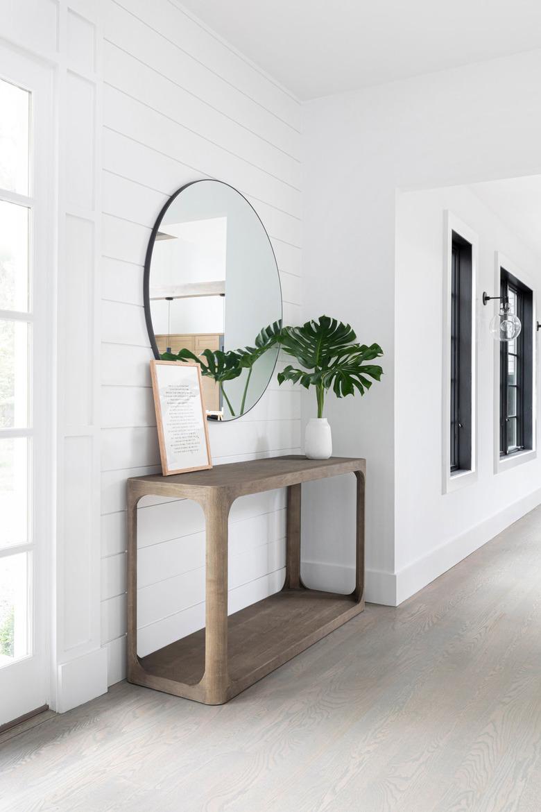 White shiplap hallway in entryway hallway by Chango & Co.