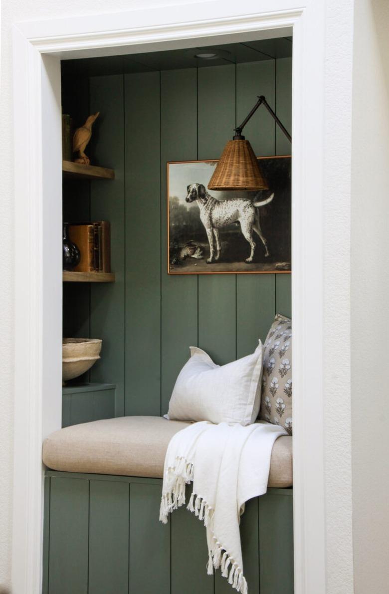 green shiplap wall in reading nook