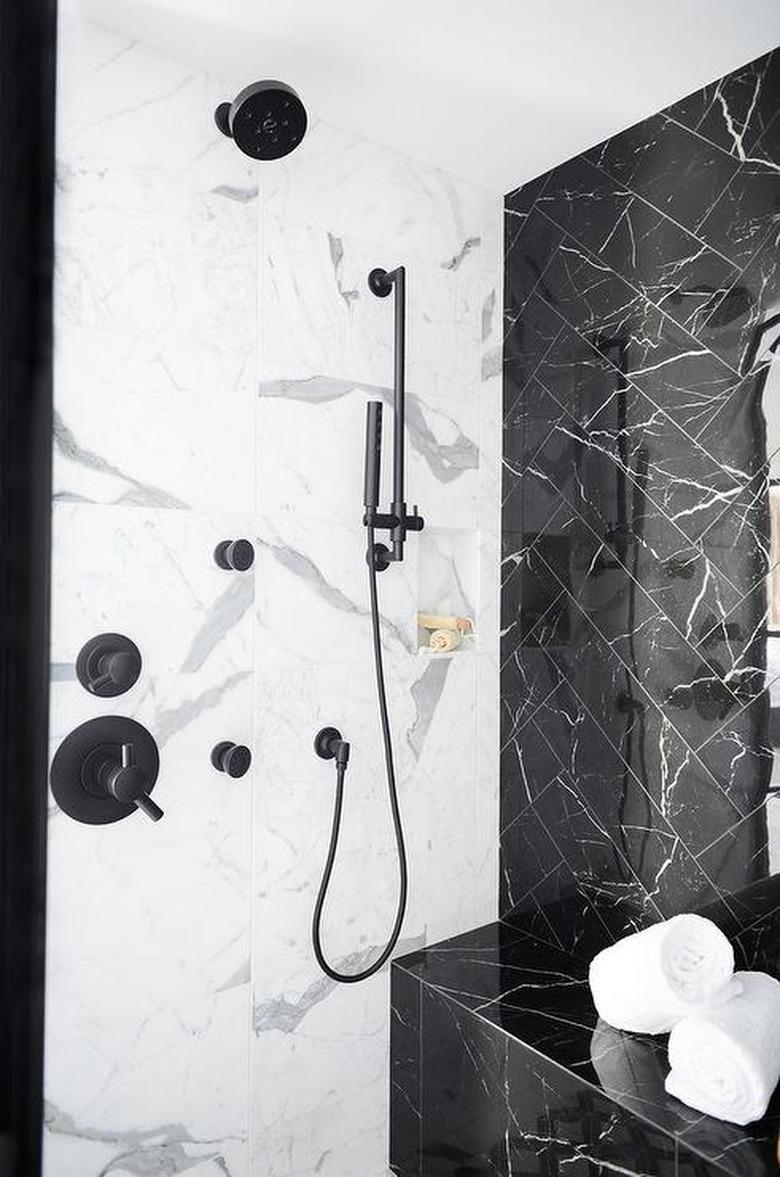 white and black marble shower tile ideas in modern bathroom