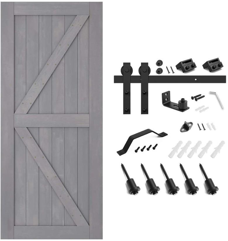 A barn door installation kit that shows the tools for the track as well as the door