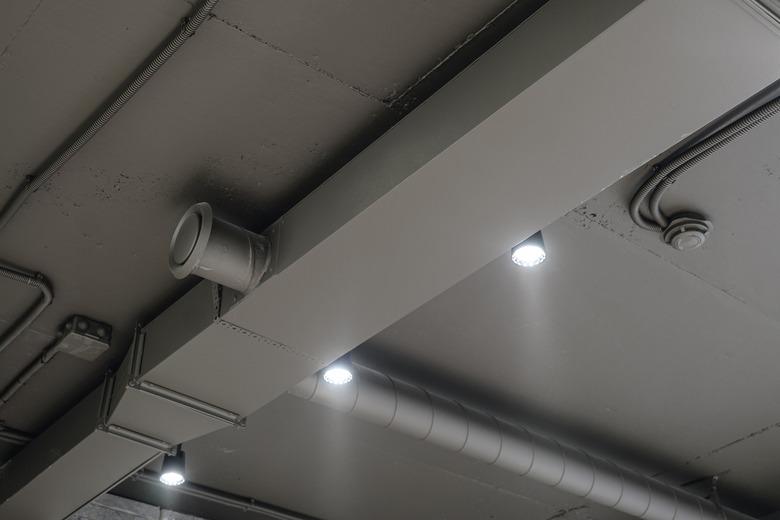 Ceiling ventilation ducts and LED lights. Engineering air system.