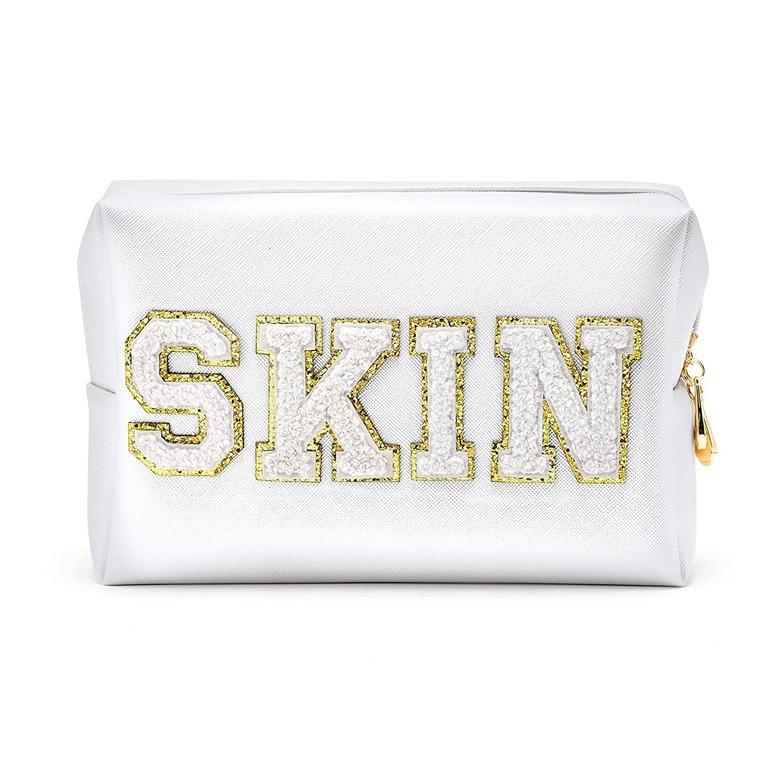 white embroidered pouch