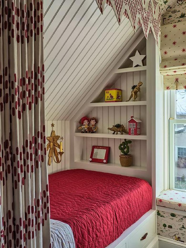 Stuffed Animal Storage with Built-in bed and shelving in a kid's room designed by Cameron Ruppert Interiors