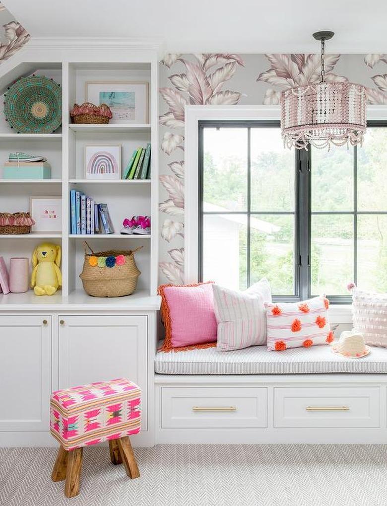 Stuffed Animal Storage in Kid's room with window seat and built-in shelves designed by Stephanie Kraus