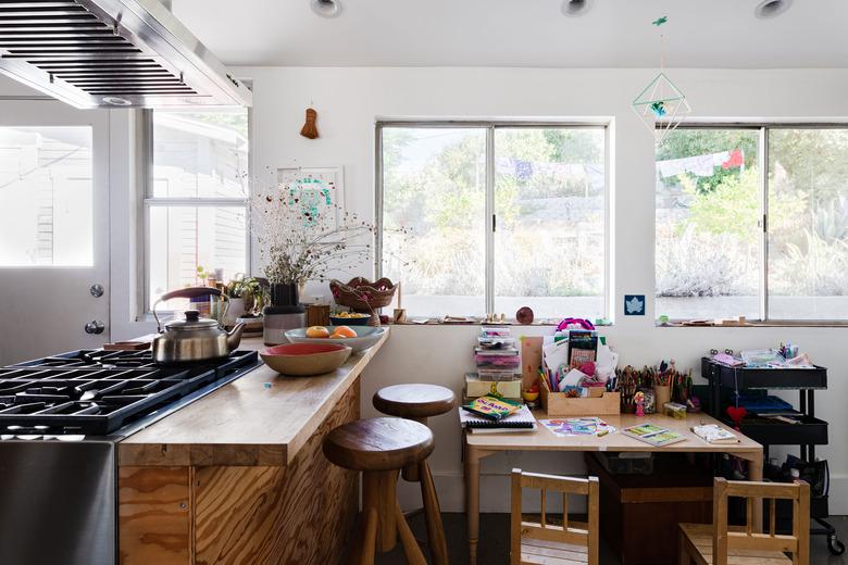 Kids dining table used as a desk and art table in a kitchen