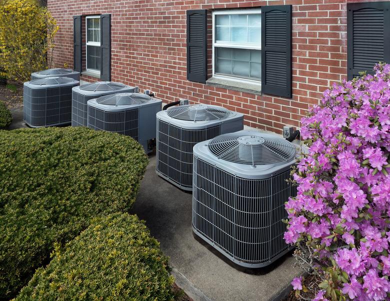 Air conditioning units outside an apartment complex