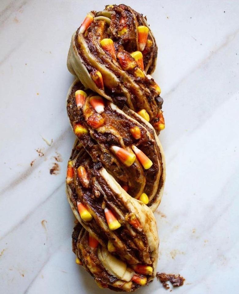 A candy corn babka on a white countertop.