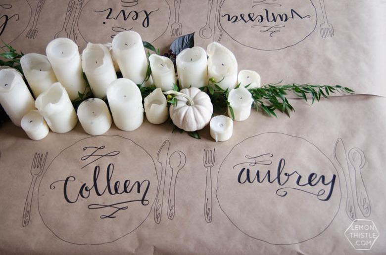 Hand lettered Thanksgiving tablecloth place settings on kraft paper