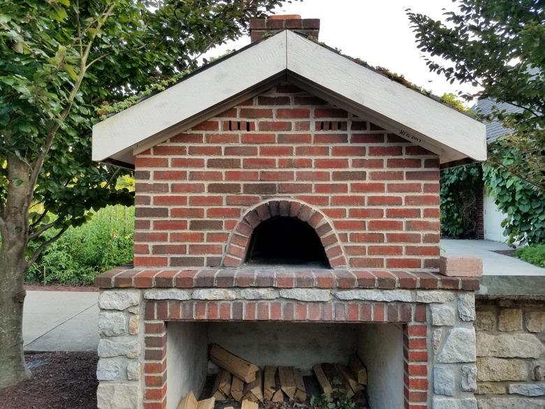 Wood-fired brick pizza oven outdoors