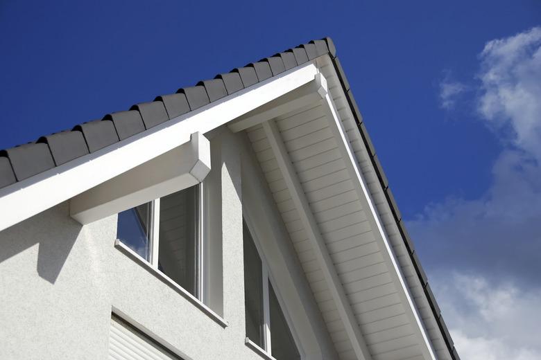 tiled roof and windows against a blue sky