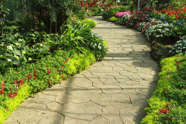 Stone walkway in flower garden.