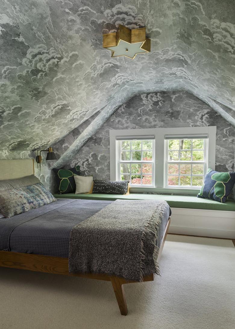 Cloud-covered pitched roof bedroom wallpaper idea