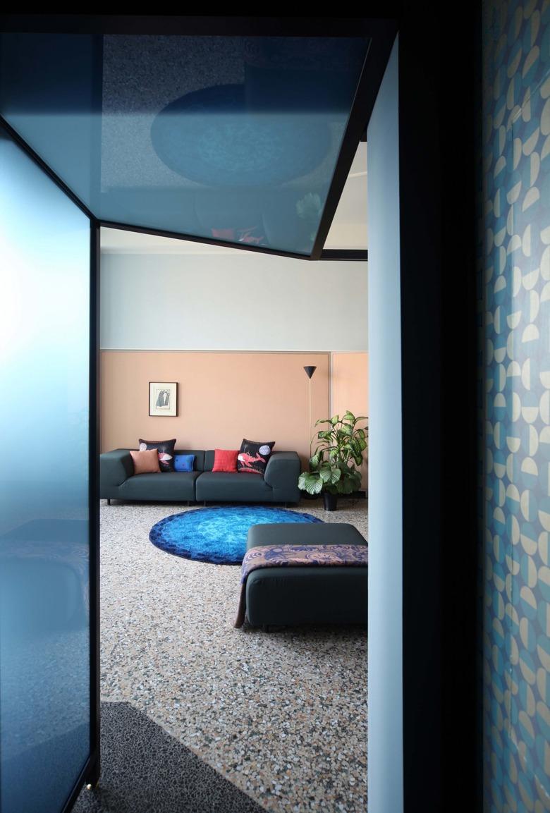 blue and pink living room with terrazzo floors