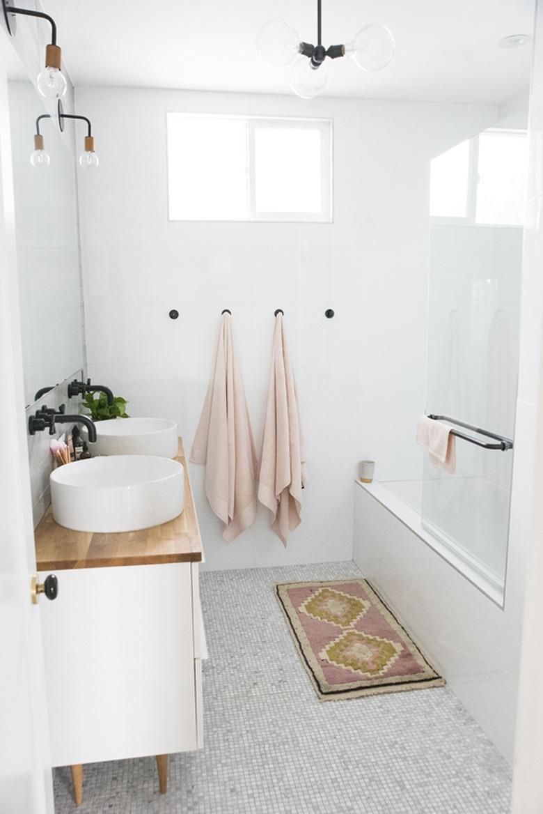 small bathroom lighting idea with wall sconces, pendant light and recessed lighting