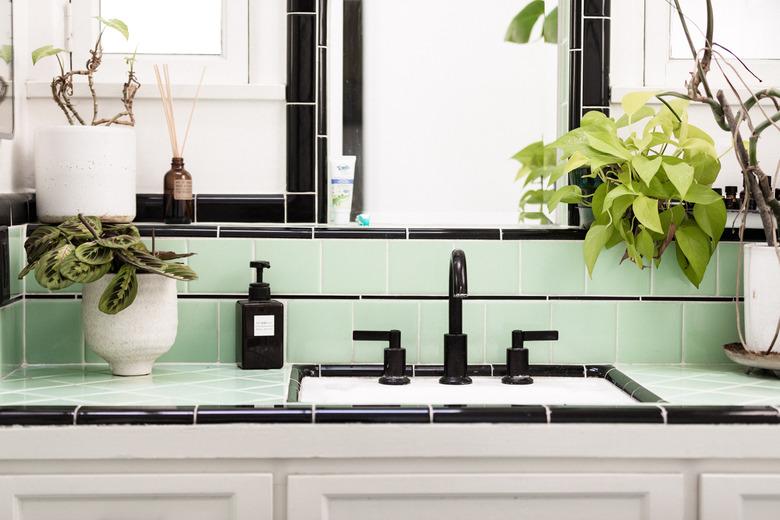 traditional bathroom backsplash with light green tile