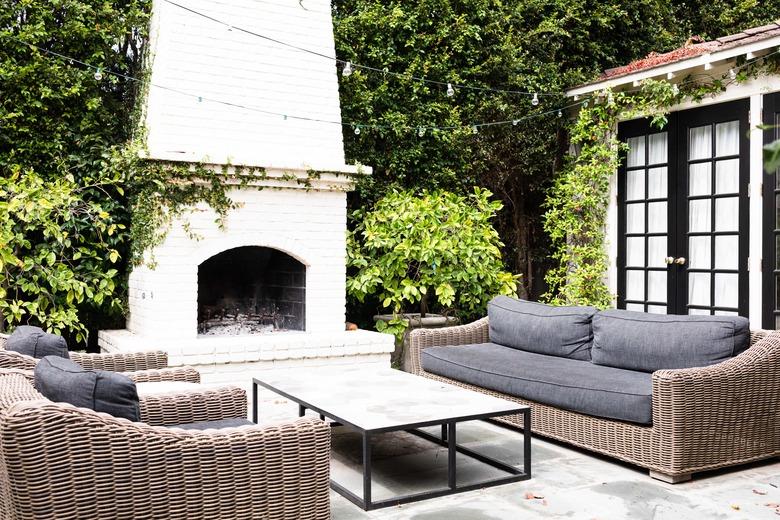 outdoor fireplace, couches and table