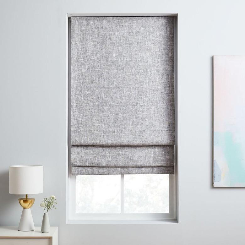 Linen roman shades over a window