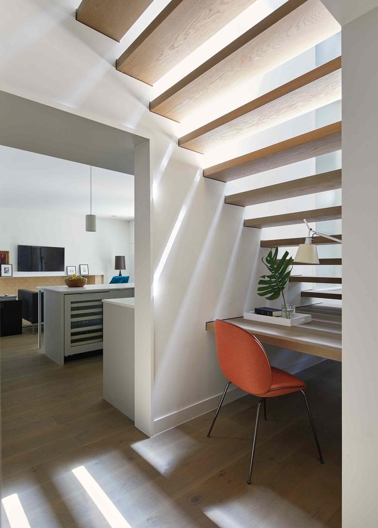 under the stair idea with simple desk and orange chair