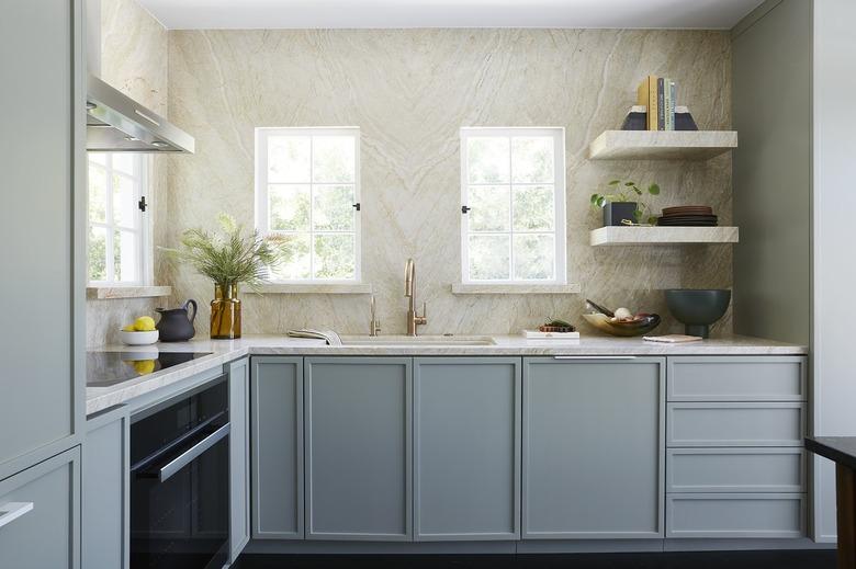 Blue craftsman kitchen with stone walls