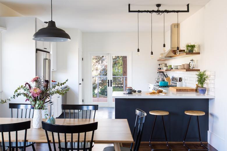 Craftsman kitchen with white and blue cabinets and white subway tile backsplash