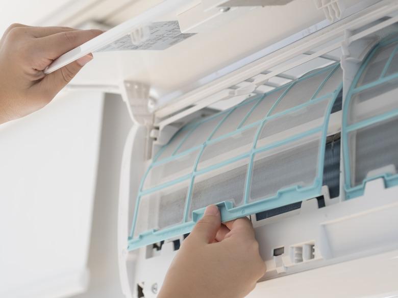 Cleaning air conditioner stock photo