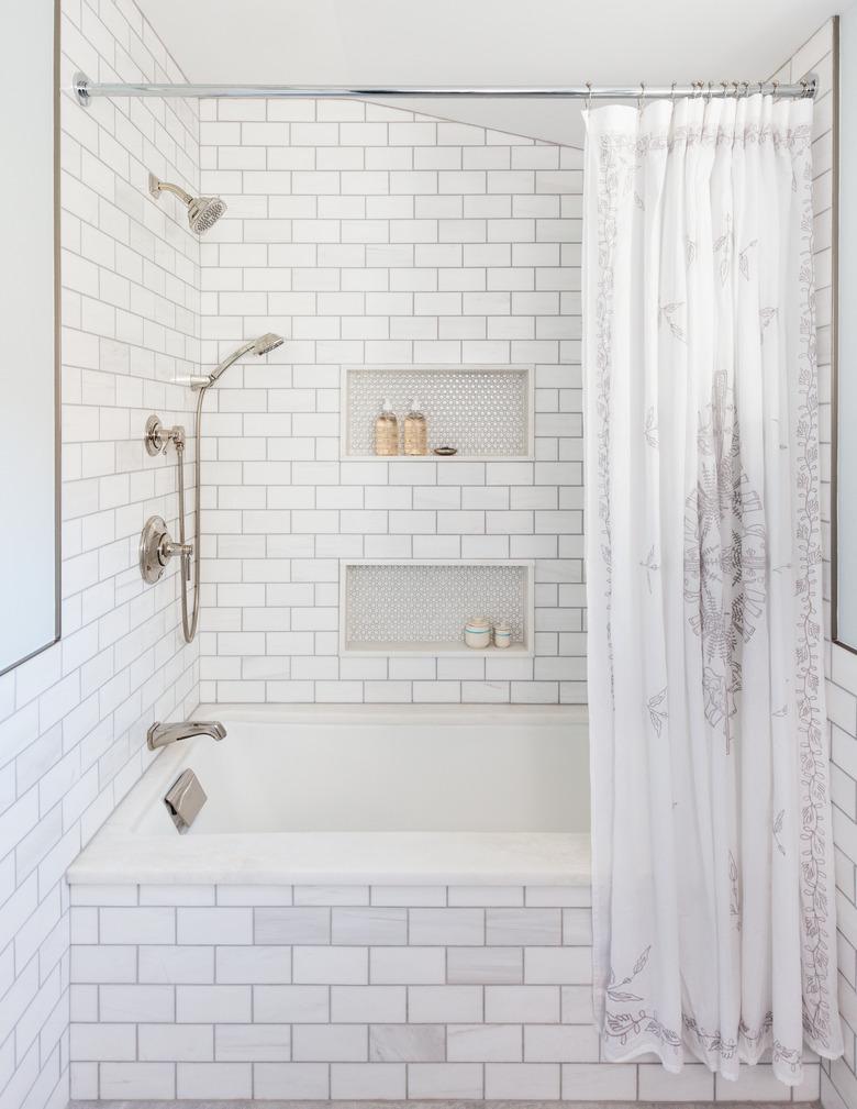 Budget bathroom remodel with subway tile in shower