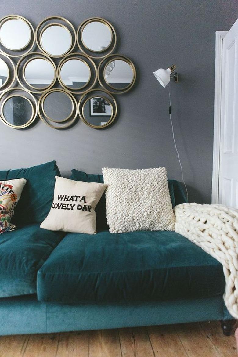 cozy living room wall decor idea with retro mirrors