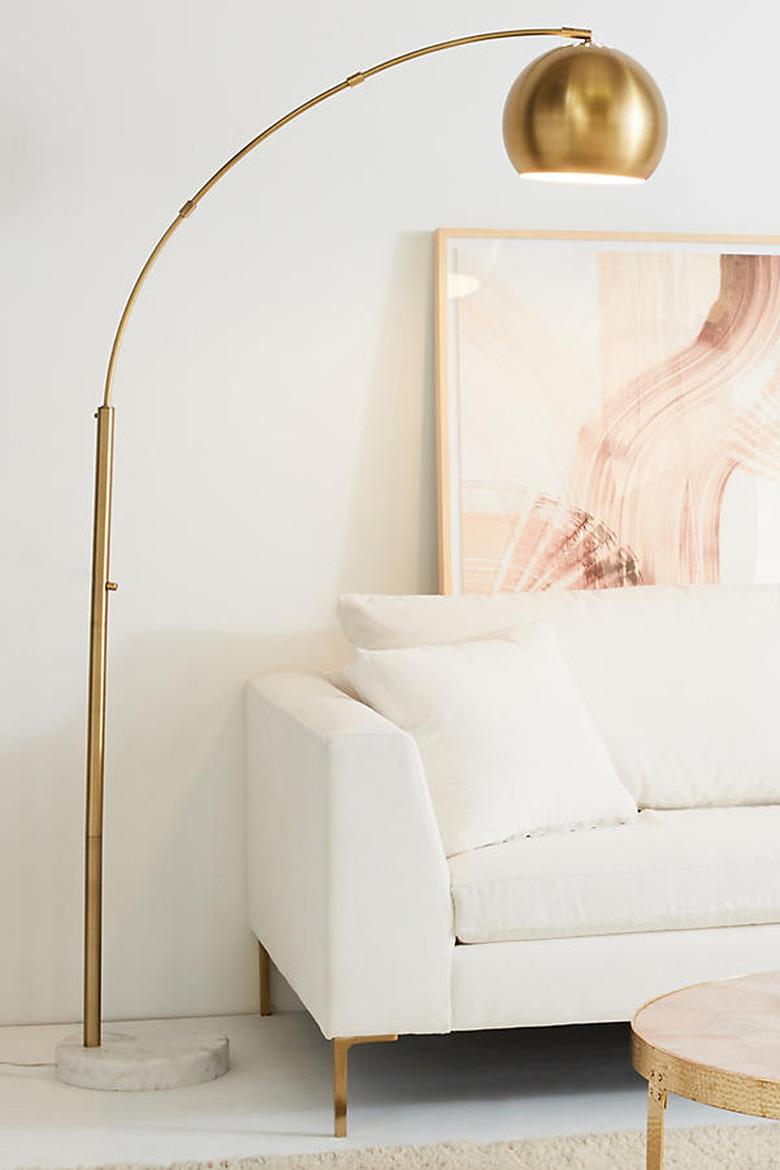 brushed brass arco lamp anthropology midcentury modern style living room