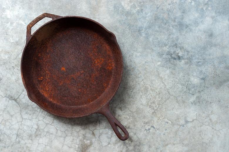 Rusty cast iron frying pan.