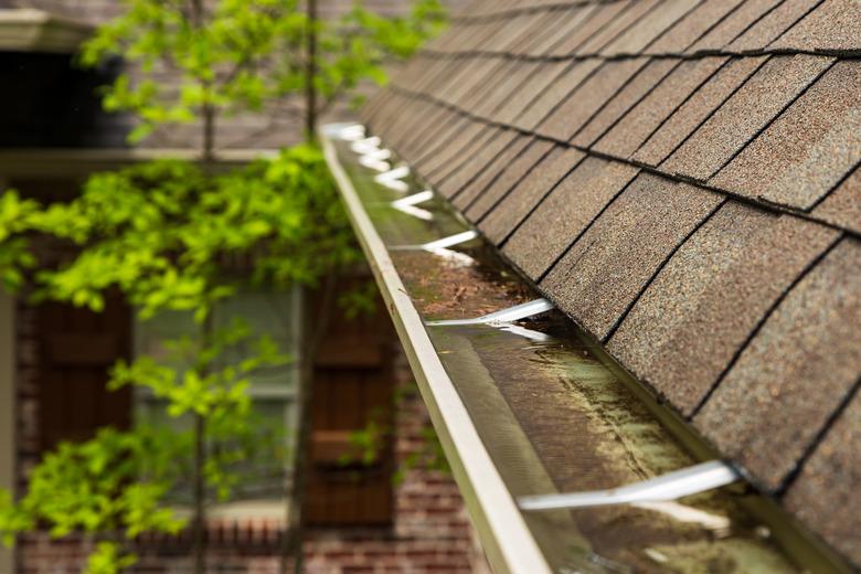 Gutter on home overflowing with water