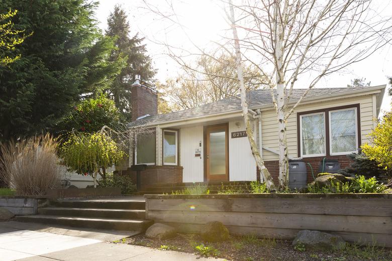 Wide exterior shot of a 1940 style bungalow style house in Portland Oregon.