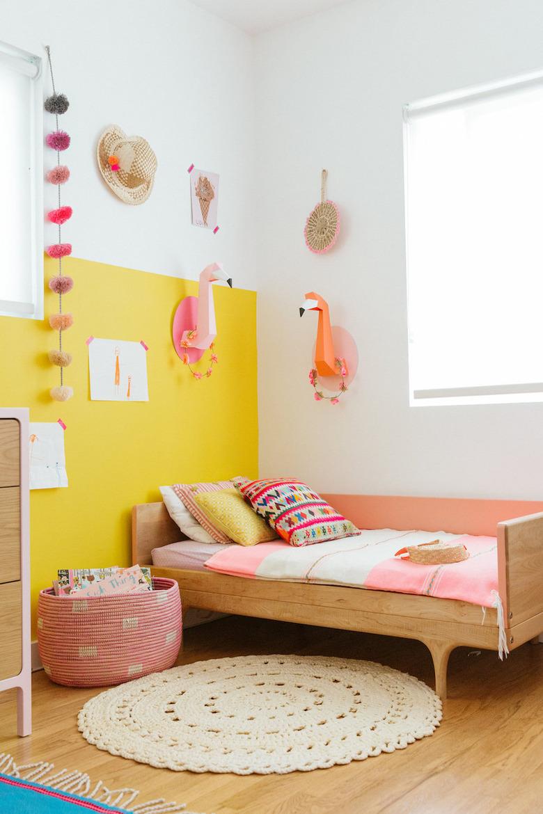 yellow kids bedroom idea with color blocking on walls and toddler bed