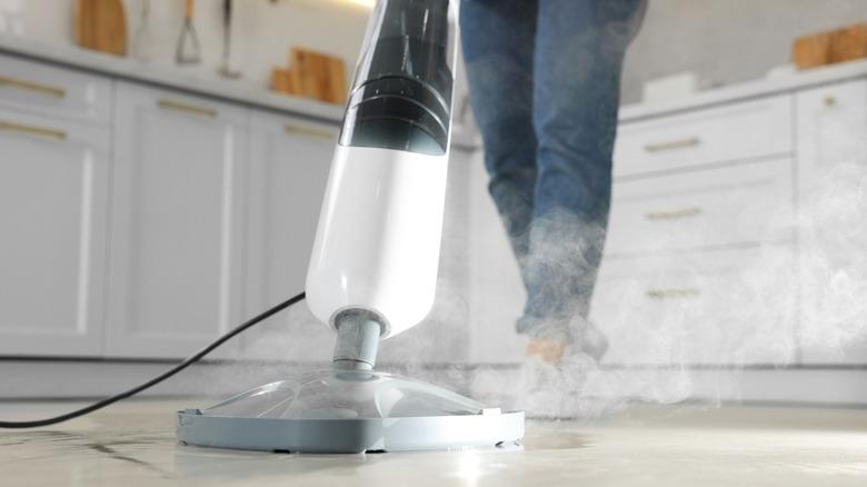 Cleaning a floor with a steam mop