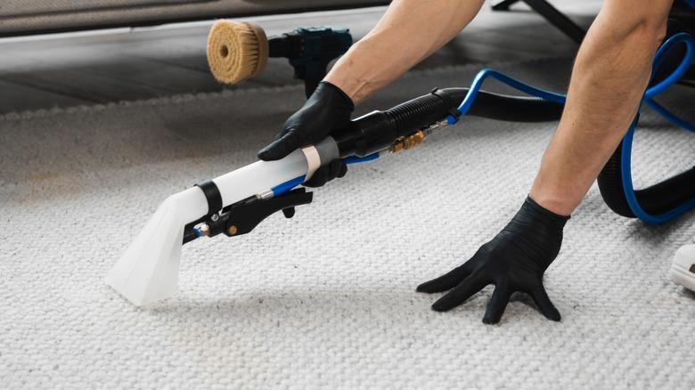 Using a cleaner and drill brush to clean carpet